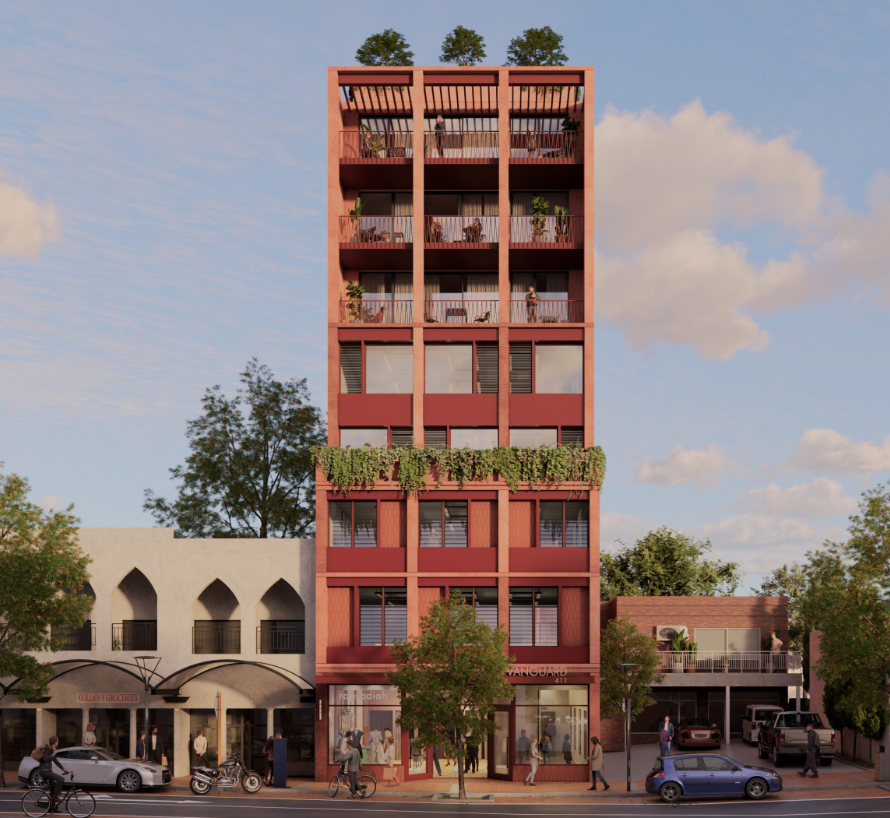 A nine storey apartment building with ground floor commercial uses.