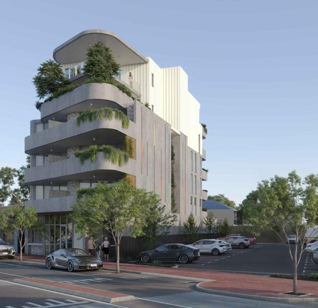 A nine storey apartment building with ground floor commercial uses.